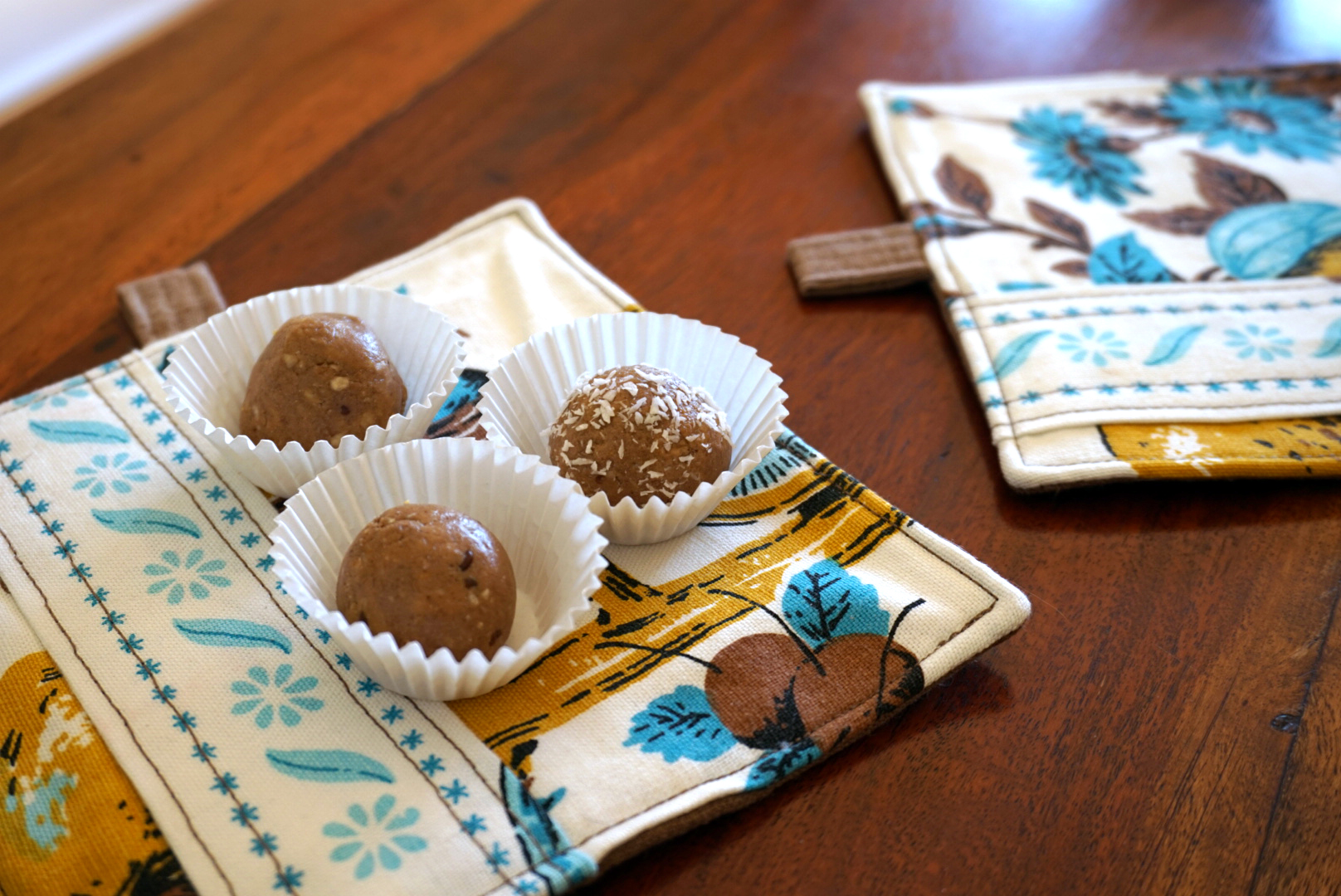 peanut butter energy balls rolled in paper mini muffin cups