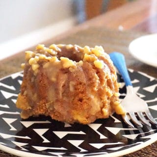 Small bundt cake on a black and white plate