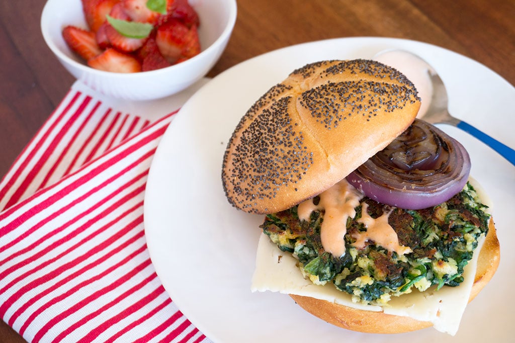 Spinach Burger on plate with onion and cheese