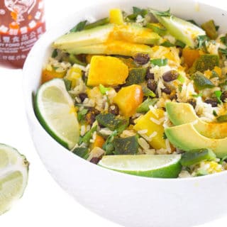 Tropical Black Beans and Rice Bowl has juicy mango, zesty lime, beans, rice and gets spiced up with a few dashes of turmeric and sriracha | PLANT BASED | VEGAN | VEGETARIAN | HEALTHY FOOD IN BOWLS | Recipe at OatandSesame.com