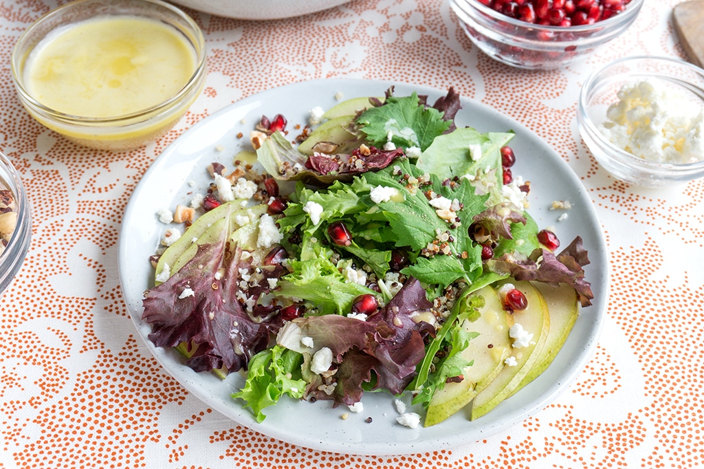 Fall Salad with Pear, Pomegranate & Orange Vinaigrette - single serving on plate
