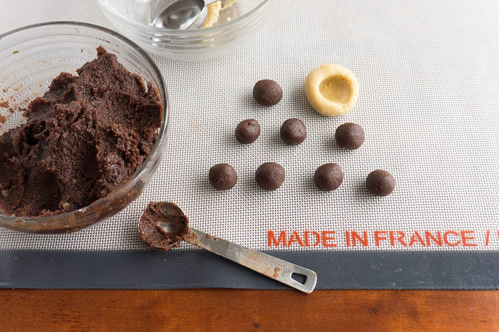 dough balls - inserting the chocolate balls into the vanilla outer dough