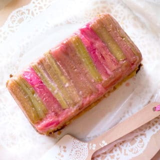 Vanilla Rhubarb Loaf Cake with strips of rhubarb lining the top of the cake.