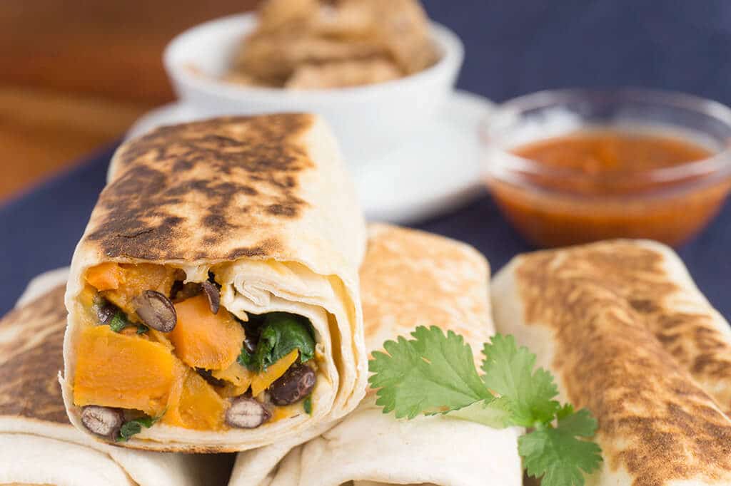 sweet potato and black bean burritos cut in half