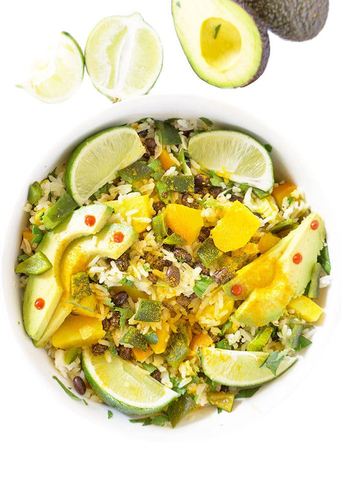 Tropical Black Bean sand Rice Bowl overhead with limes and avocado