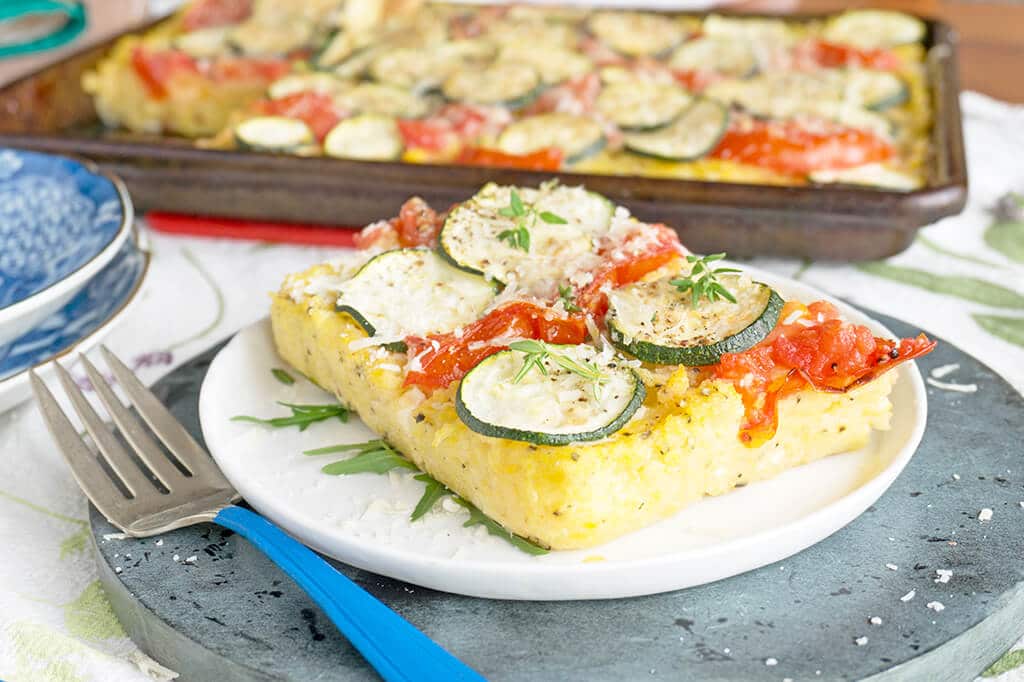 Baked Polenta with Zucchini and Tomatoes slice on plate