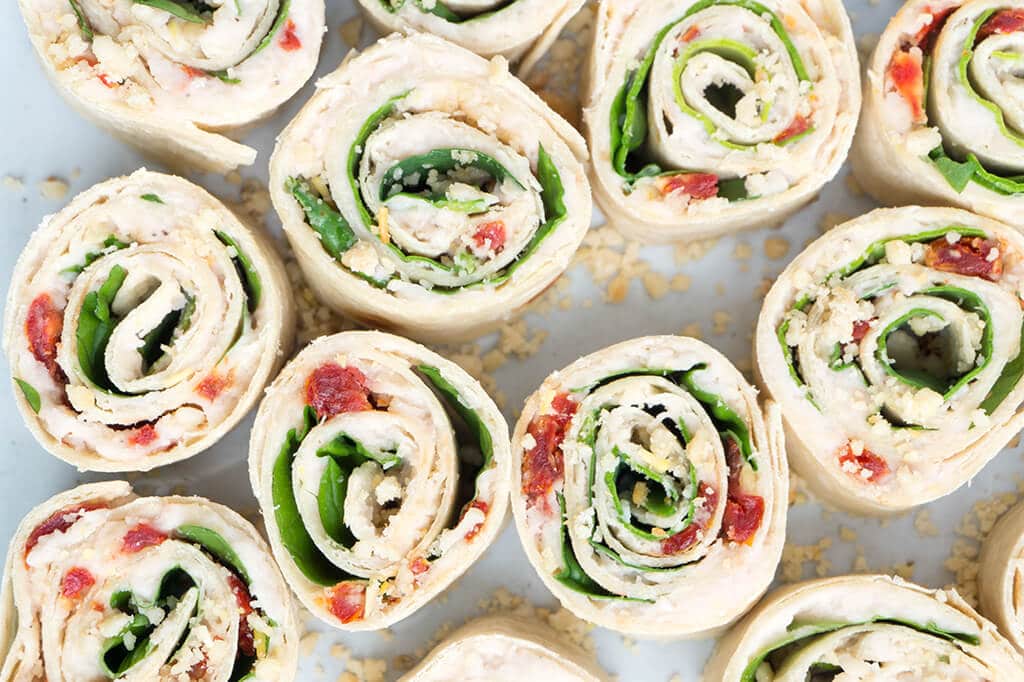 Sun-Dried Tomato, Basil and Spinach Pinwheels - lots of rolls cut in pieces