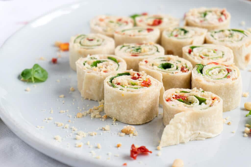 Sun-Dried Tomato, Basil and Spinach Pinwheels on platter