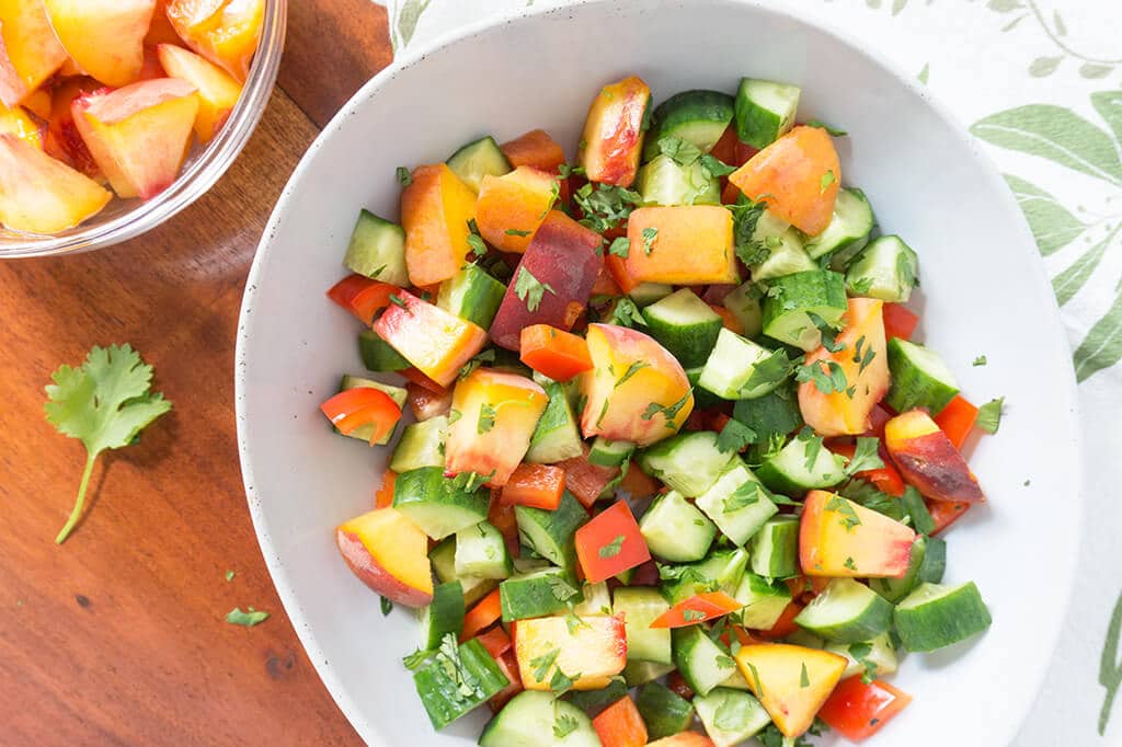 Sweet Peach Cucumber Salad in bowl overhead