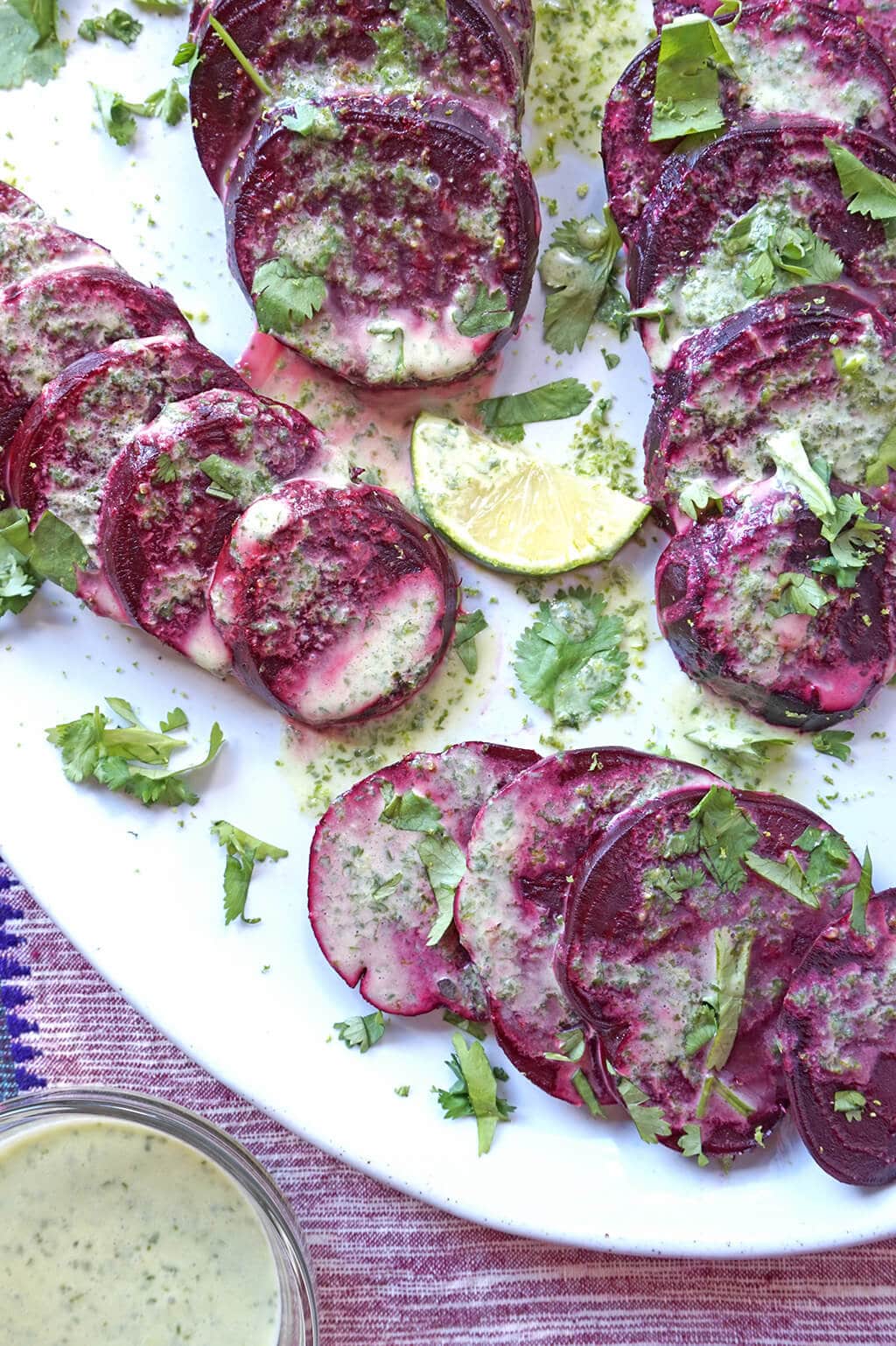 Beet & Chickpea Salad with Coconut Lime Dressing sliced on platter