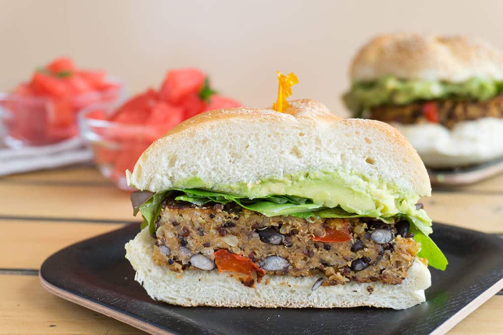 Black Bean Quinoa Burger on bun sliced in half