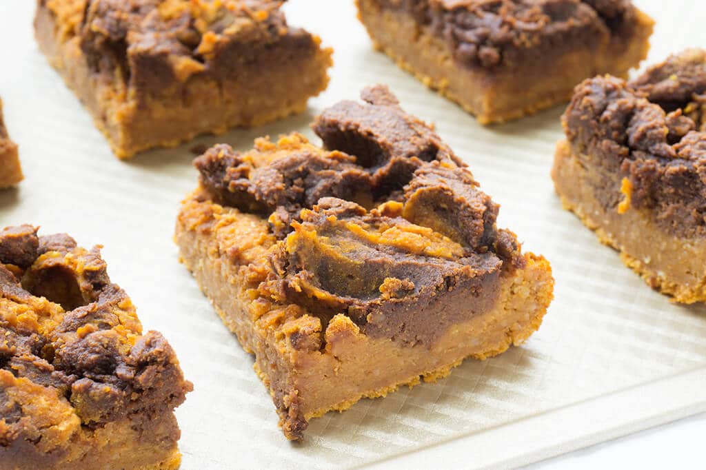 Vegan Pumpkin Pie Bars - squares in a line on baking sheet