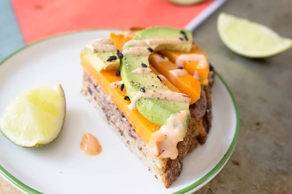 Sweet Potato Avocado Toast cut in half on plate