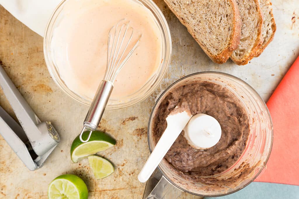 chipotle aioli and black bean spread in bowls