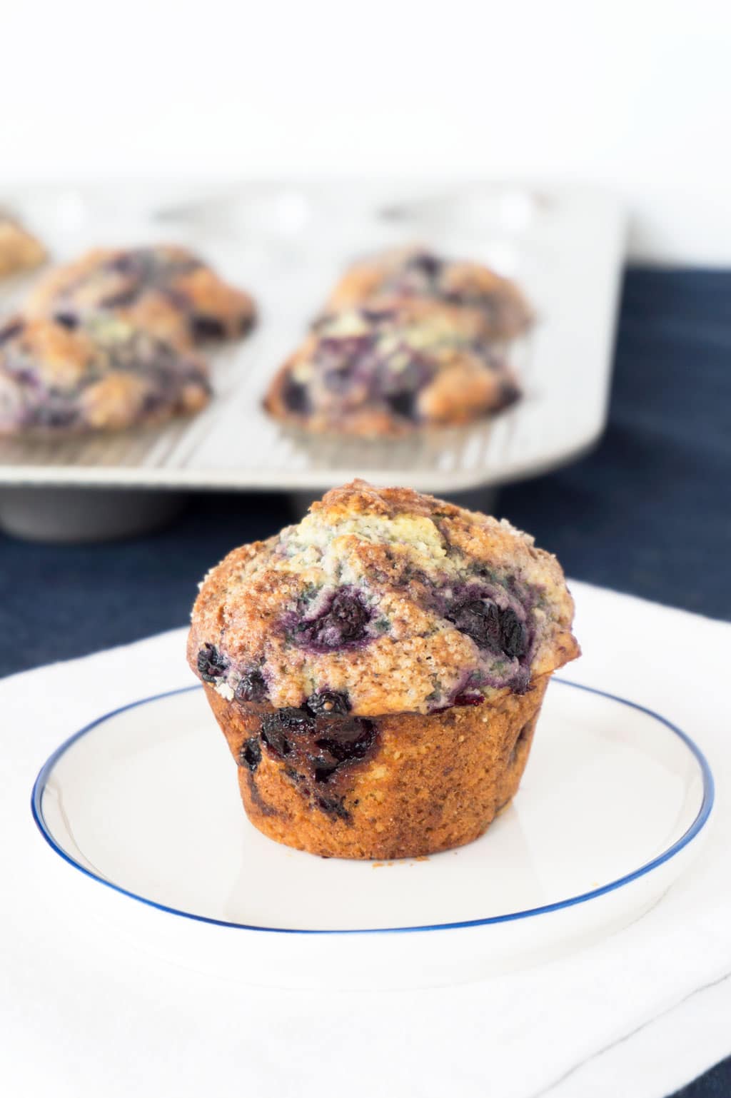 Vanilla Blueberry Muffin with pan in background