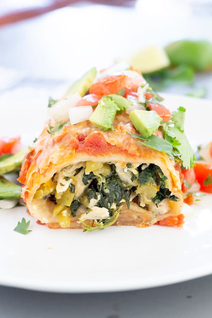 Chicken and Spinach Burrito cut on plate, vertical