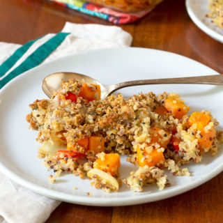 Butternut Squash Gratin on a white plate with silver spoon