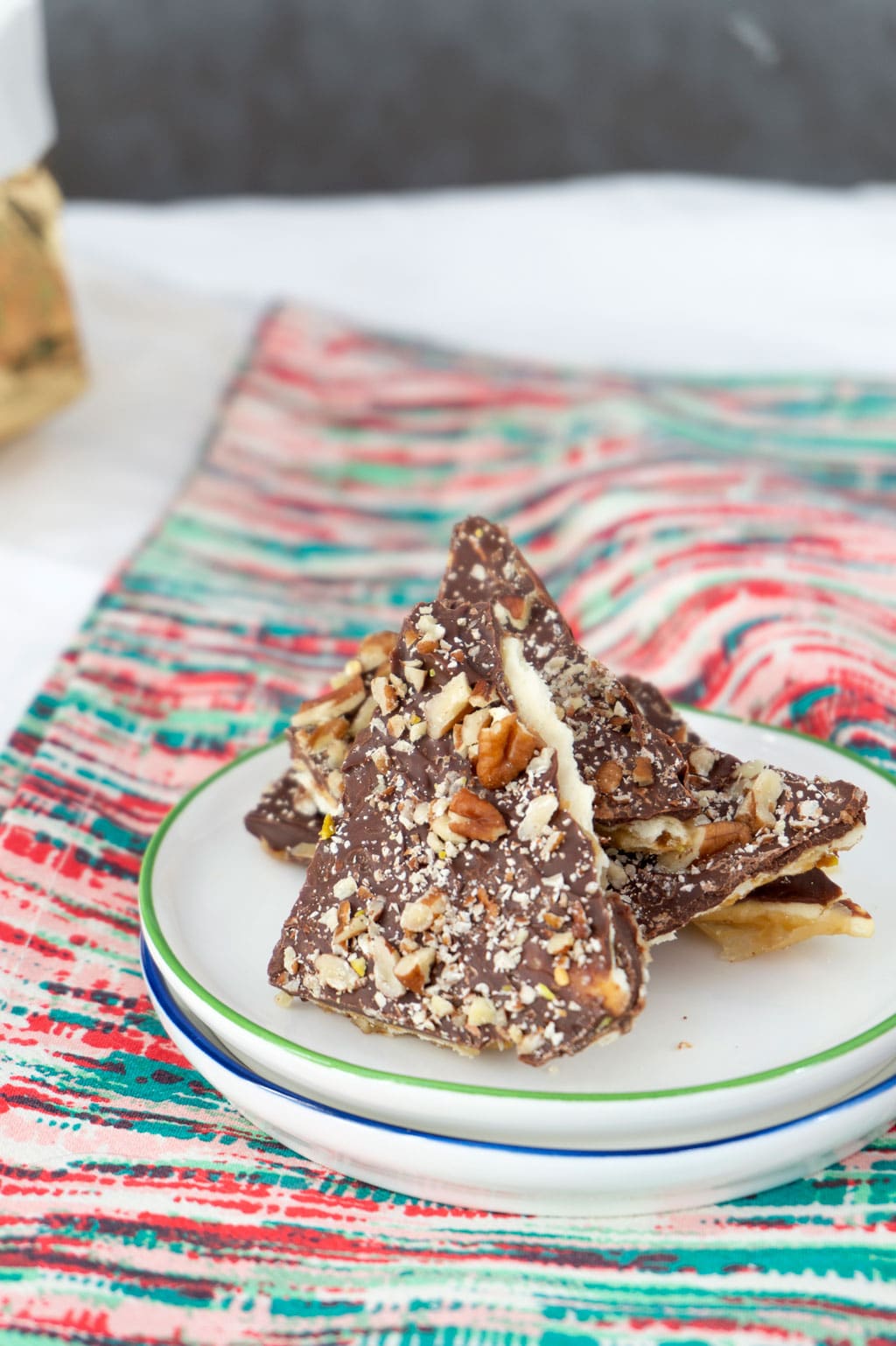 Saltine Toffee - edge on plate with pecans