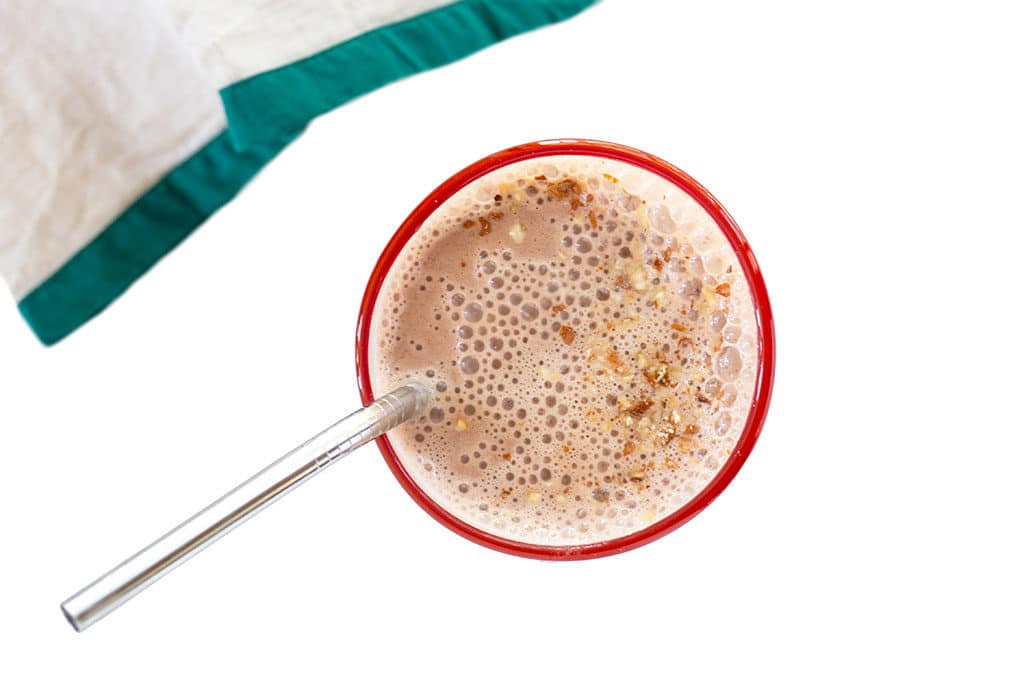 Healthy Vegan Chocolate Shake overhead with stainless steel straw