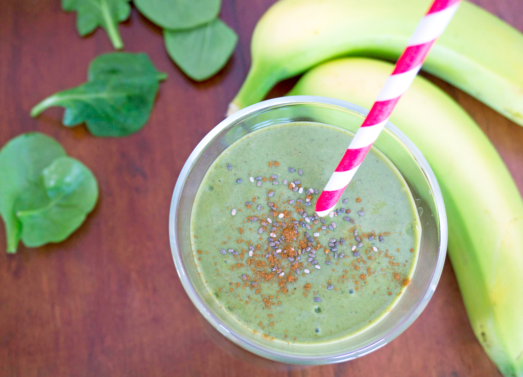 spinach smoothie with striped straw