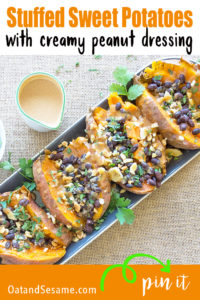 These Stuffed Sweet Potatoes with Peanut Sauce will change your sweet potato game! This recipe takes your basic baked sweet potato and stuffs it with an assortment of yum - black beans, banana chips, lime, cilantro and a creamy peanut sauce! #SweetPotatoRecipes | #LunchIdeas | #VeganRecipes | #VegetarianRecipes at OatandSesame.com