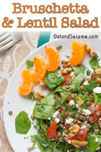 Bruschetta Lentil Salad combines fresh greens, protein packed lentils and is then topped with a tomato bruschetta dressing and nuts. | #lentilrecipes | #saladrecipes | #vegetarianrecipes | #bruschetta | #healthyrecipeseasy at OatandSesame.com #oatandsesame