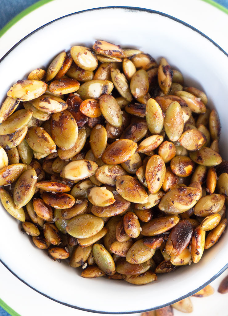 a bowl of chile lime roasted pepitas closeup