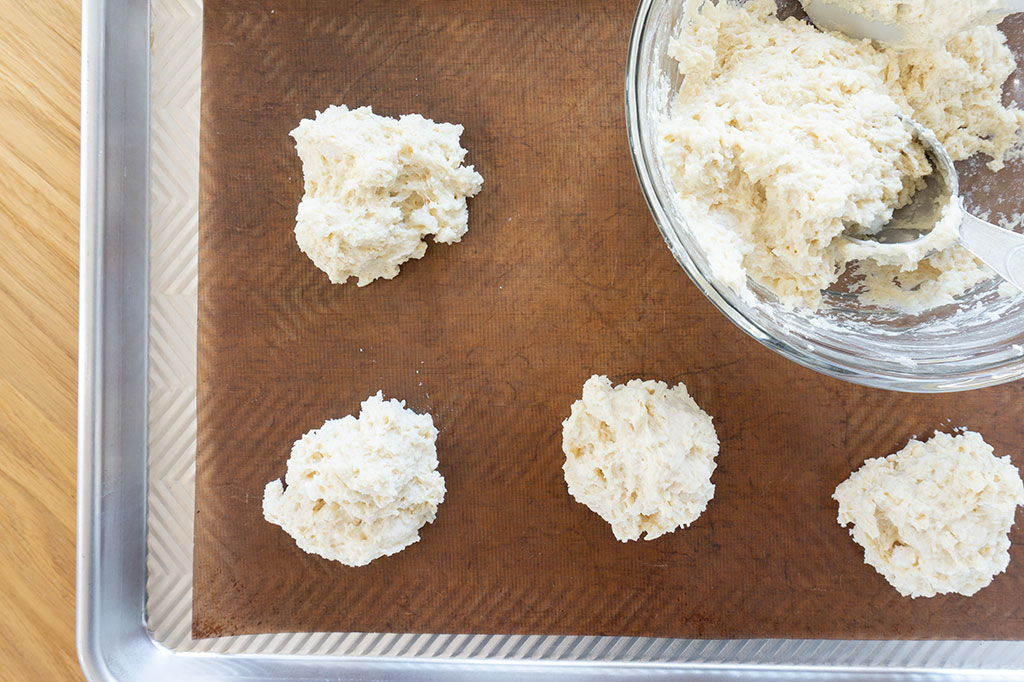 uncooked vegan biscuits on cookie sheet