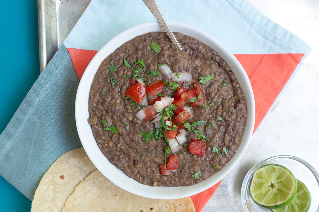 Black Bean Dip topped with tomatoes and onions