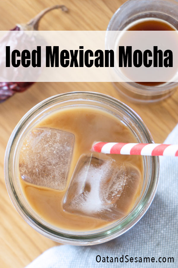 This Mexican Iced Mocha takes your standard mocha and gives it a little spice with cinnamon and chili powder. Wake up to this iced coffee all summer long paired with your favorite breakfast tacos or my favorite coffee cake recipe. | #COFFEE | #ICEDMOCHA | #VEGANRECIPES | #COFFEERECIPES | #BREAKFASTRECIPES | OatandSesame.com #oatandsesame