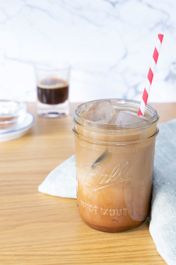 Iced Mocha in glass with red and white straw