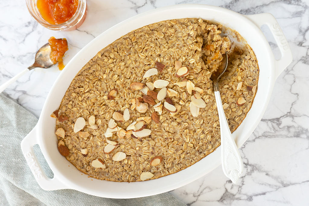 Almond Croissant Baked Oatmeal in a white oval ceramic dish