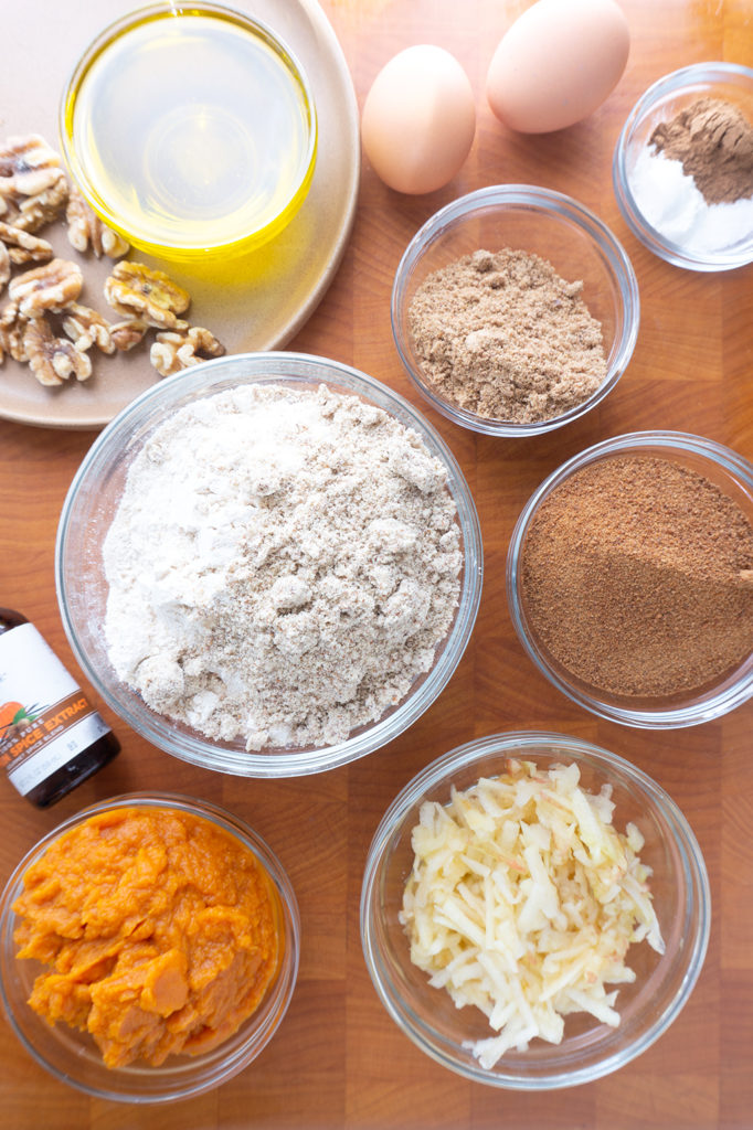 whole wheat pumpkin muffin ingredients in bowls