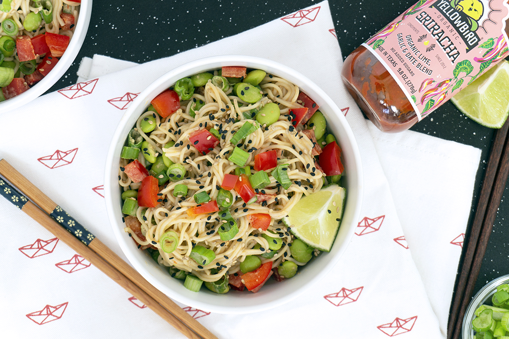 Tahini Noodle Bowl with red peppers and edamame on top
